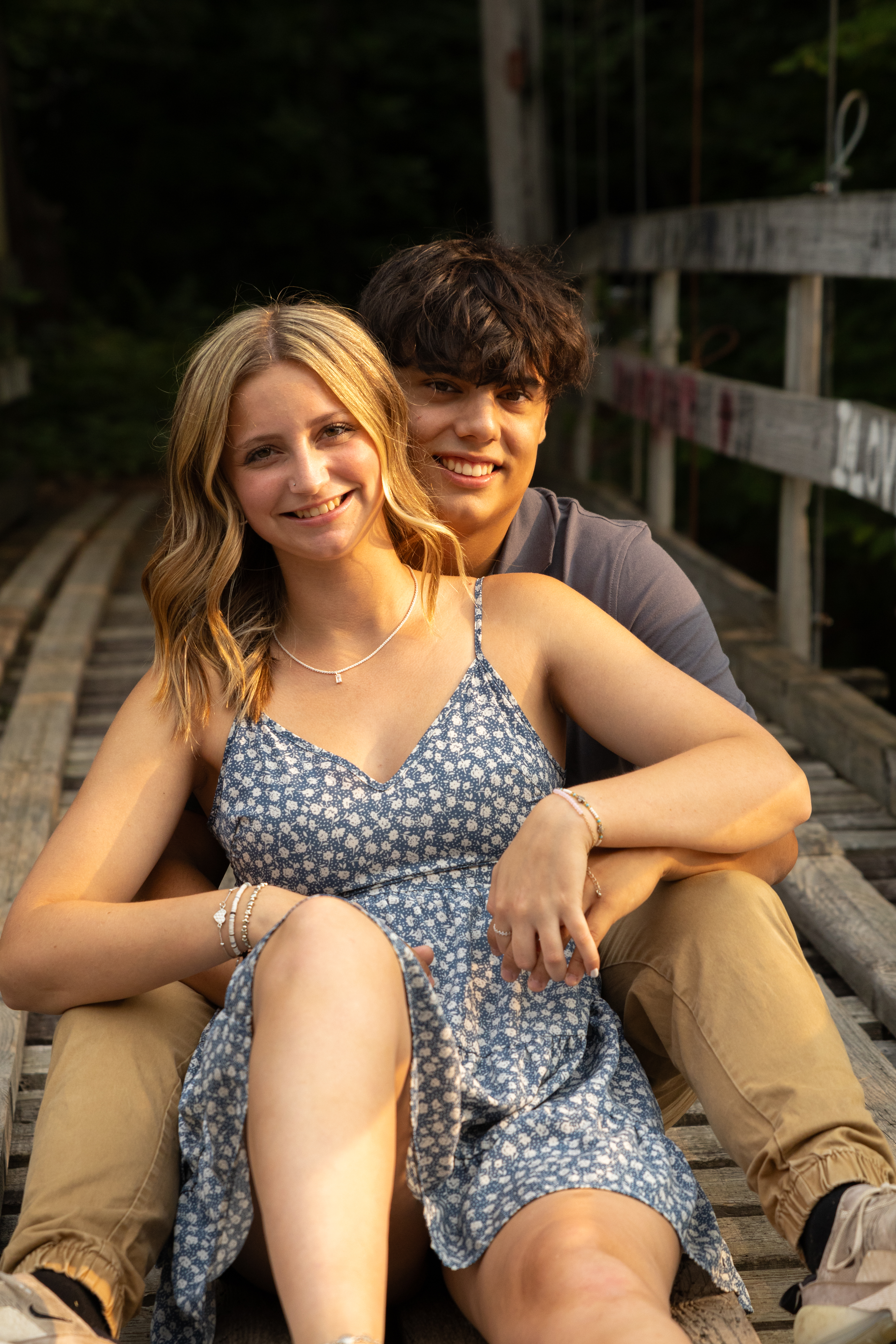 Couple Sitting on Bridge